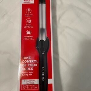 New in box, Revlon curling iron. Never used.